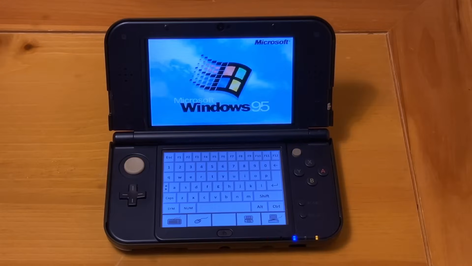 Cast your eyes upon this deeply cursed setup: Windows 95 on a hacked Nintendo 3DS