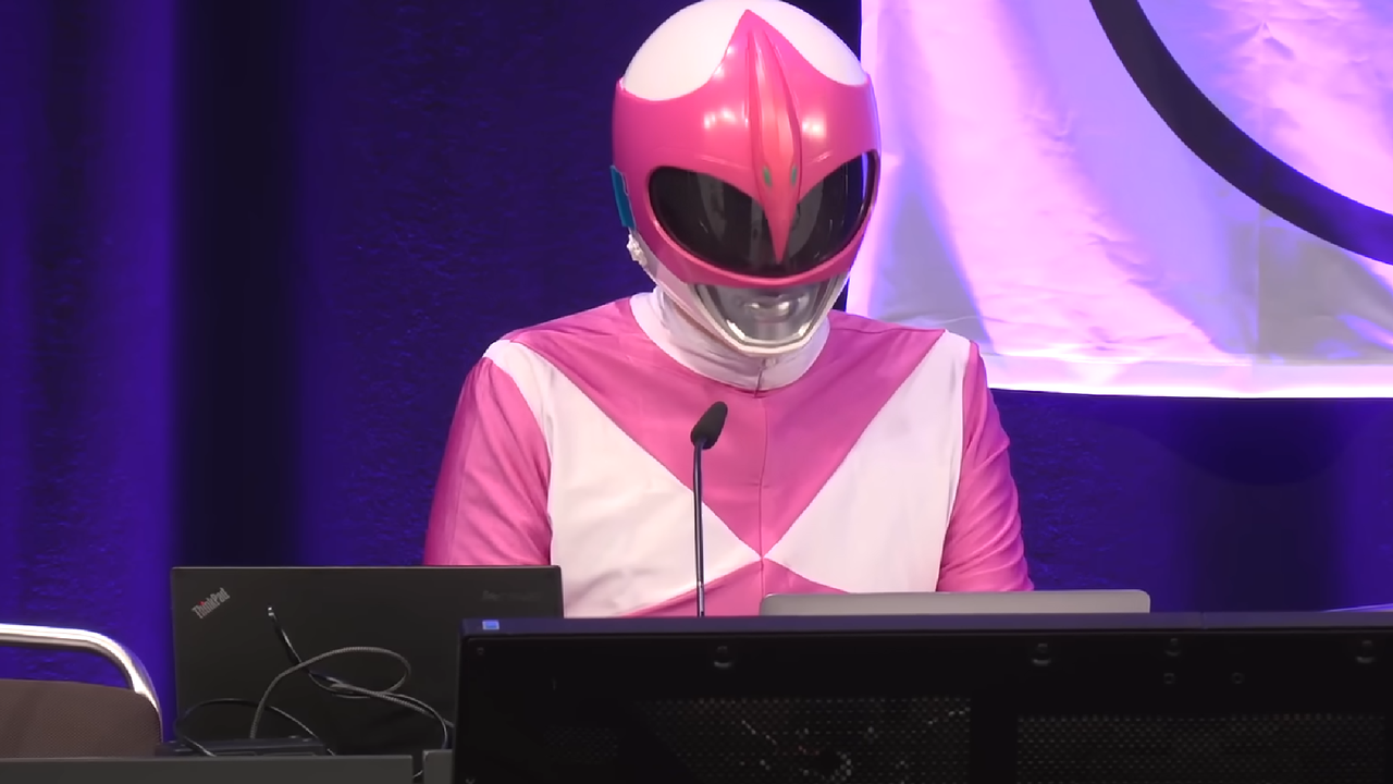 Hacker, dressed as the pink Power Ranger, takes down 3 white supremacist sites live on stage after scraping details with AI: ‘Maybe try mastering to host WordPress before world domination’